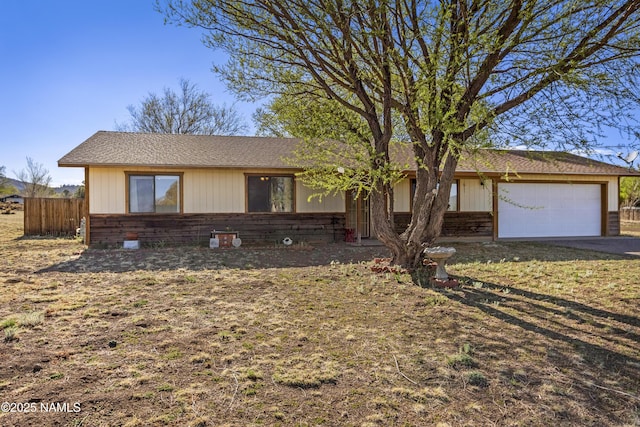 11280 N Zady Ln, Flagstaff, AZ 86004 - ranch-style house featuring a garage, fence, and aphalt driveway