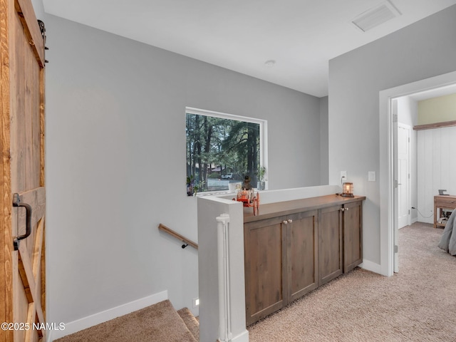 867 Onieda, Flagstaff, AZ 86005 - corridor with light carpet, baseboards, and an upstairs landing