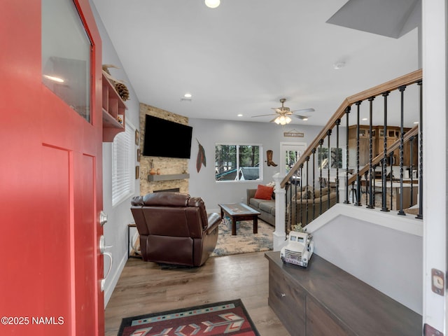867 Onieda, Flagstaff, AZ 86005 - living area featuring stairway, ceiling fan, wood finished floors, a fireplace, and recessed lighting