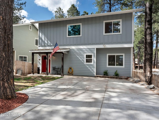 867 Onieda, Flagstaff, AZ 86005 - view of front facade with board and batten siding, fence, and a patio area