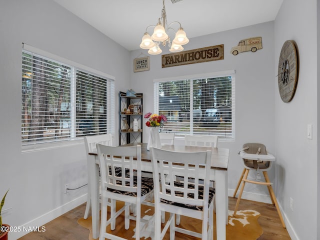 867 Onieda, Flagstaff, AZ 86005 - dining room featuring a chandelier, wood finished floors, and baseboards