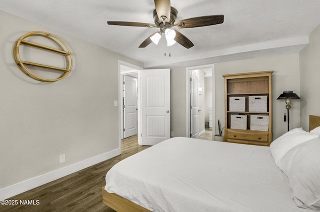 4573 Canyon Loop, Flagstaff, AZ 86005 - bedroom with baseboards, wood finished floors, ensuite bathroom, and a ceiling fan