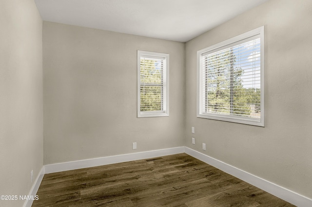 4573 Canyon Loop, Flagstaff, AZ 86005 - unfurnished room featuring dark wood-type flooring and baseboards