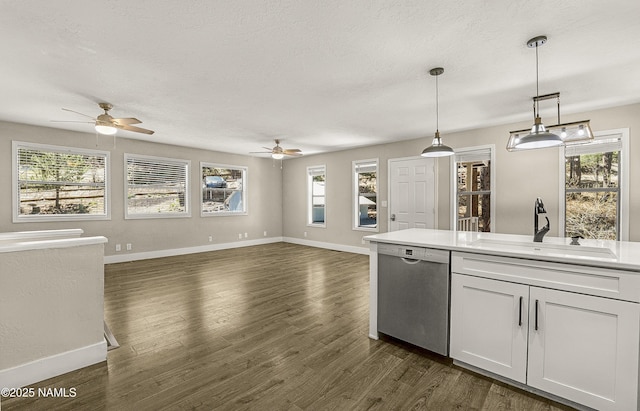 4573 Canyon Loop, Flagstaff, AZ 86005 - kitchen featuring dishwasher, a sink, a ceiling fan, healthy amount of natural light, and a textured ceiling