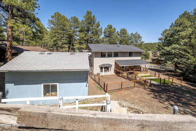 4573 Canyon Loop, Flagstaff, AZ 86005 - back of house with an exterior structure and an outbuilding