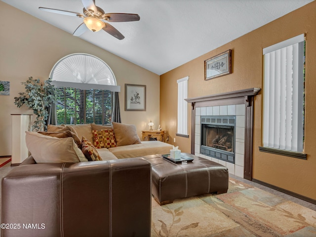 3114 N Connor St, Flagstaff, AZ 86004 - living room featuring ceiling fan, vaulted ceiling, a tiled fireplace, and a textured wall