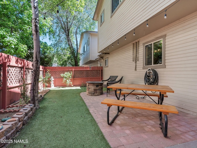 3114 N Connor St, Flagstaff, AZ 86004 - fenced backyard with a fire pit and a patio area