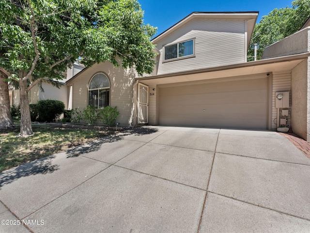 3114 N Connor St, Flagstaff, AZ 86004 - view of front of house featuring driveway and an attached garage