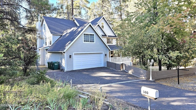 view of front facade with a garage and cooling unit