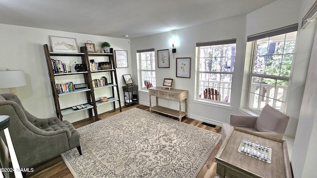 sitting room with hardwood / wood-style floors