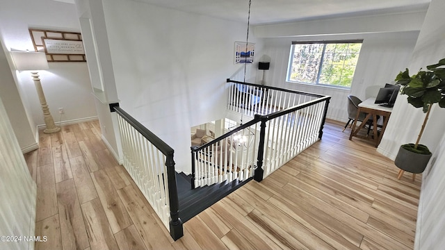 staircase featuring hardwood / wood-style flooring