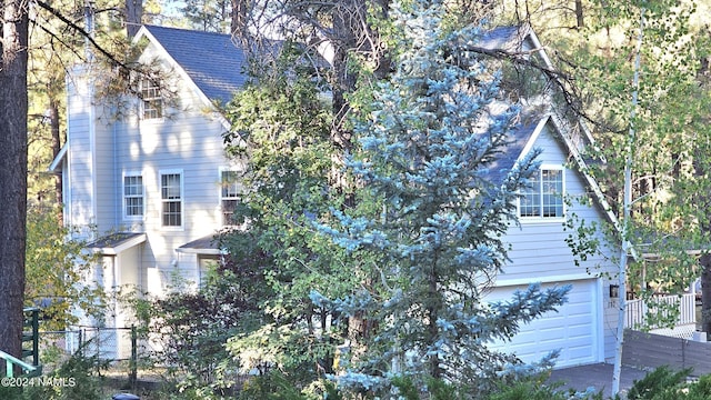 view of side of property featuring a garage