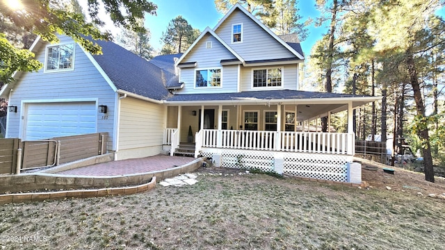 view of front of property with a garage and covered porch