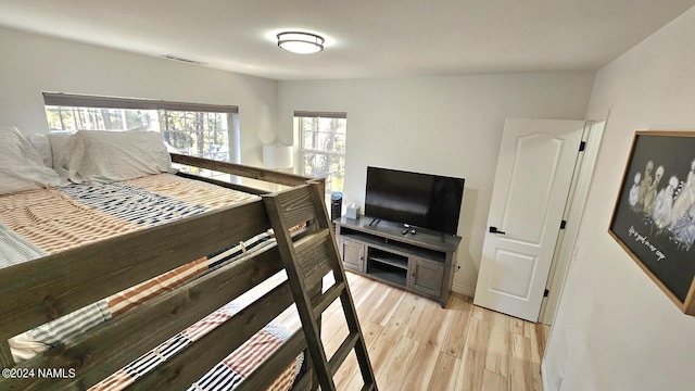 bedroom with light hardwood / wood-style floors