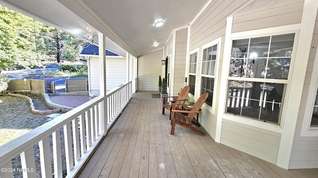 wooden terrace featuring a porch