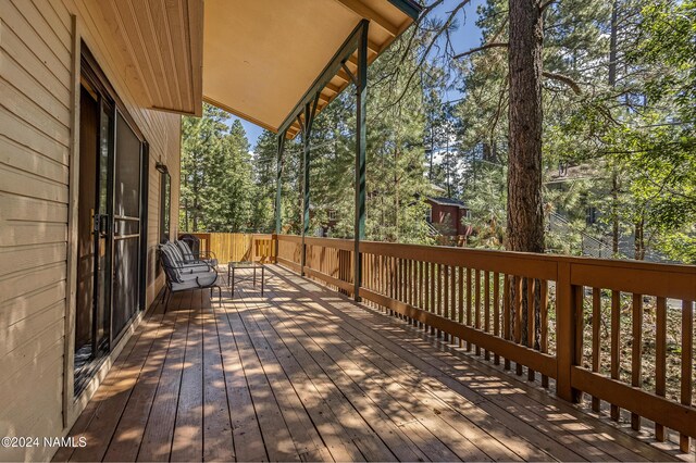 335 Sandia Cir, Munds Park, AZ 86017 - wooden terrace featuring view of scattered trees