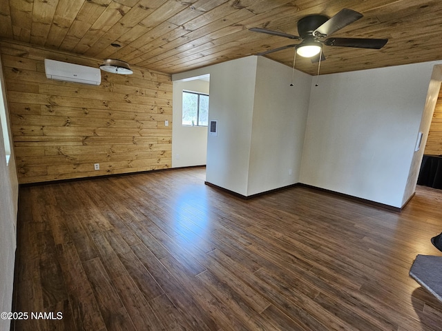 588 W Mesa Dr, Williams, AZ 86046 - empty room featuring a wall mounted air conditioner, wood ceiling, a ceiling fan, dark wood-type flooring, and baseboards