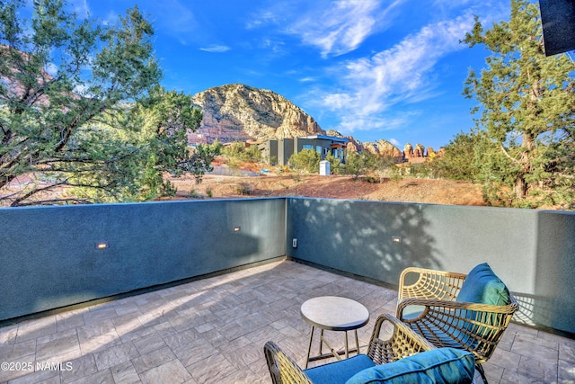 view of patio / terrace with a mountain view