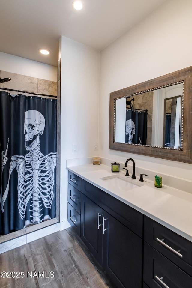 bathroom featuring vanity, recessed lighting, wood finished floors, and a shower with curtain