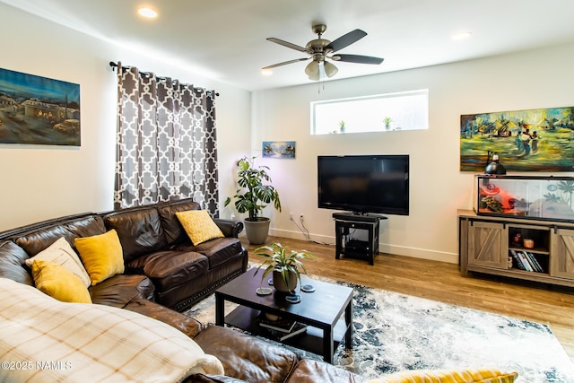 living room with baseboards, recessed lighting, ceiling fan, and wood finished floors