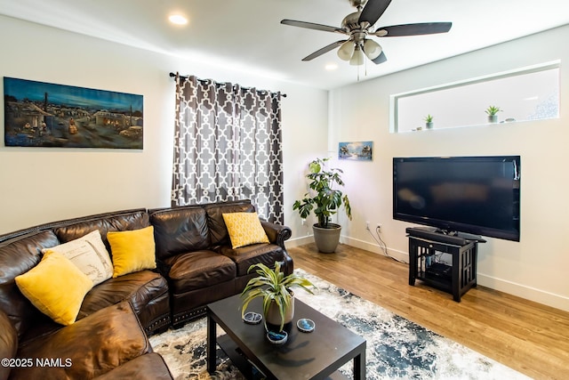 living area featuring baseboards, ceiling fan, recessed lighting, and wood finished floors