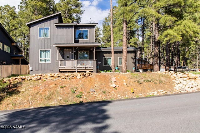 view of front of house featuring board and batten siding and covered porch