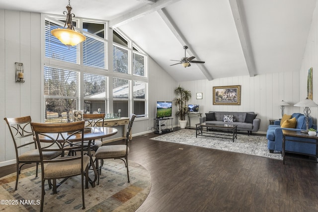 dining space with dark wood finished floors, beam ceiling, baseboards, and ceiling fan