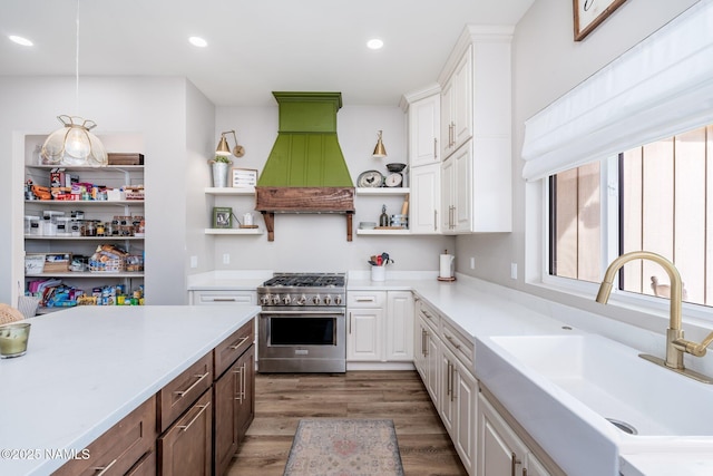 6552 Kelsey Springs Way, Flagstaff, AZ 86001 - kitchen featuring high end range, open shelves, custom range hood, a sink, and white cabinets