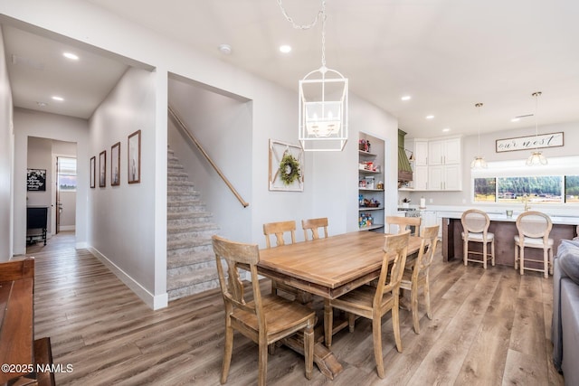 6552 Kelsey Springs Way, Flagstaff, AZ 86001 - dining space with recessed lighting, light wood-type flooring, baseboards, and stairs