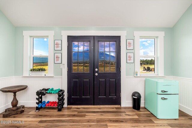 6552 Kelsey Springs Way, Flagstaff, AZ 86001 - entryway featuring wainscoting, wood finished floors, and plenty of natural light