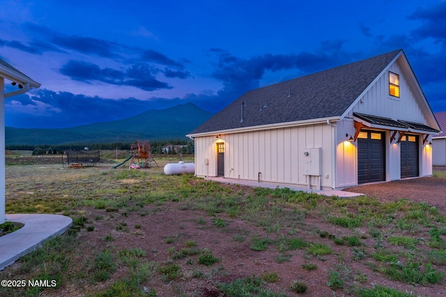 6552 Kelsey Springs Way, Flagstaff, AZ 86001 - garage at dusk with a mountain view and a garage