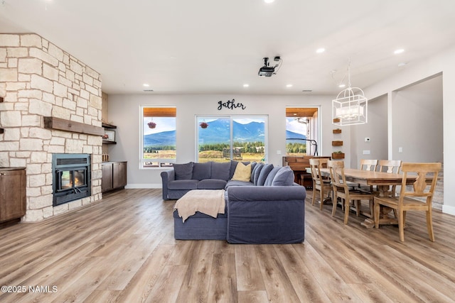 6552 Kelsey Springs Way, Flagstaff, AZ 86001 - living area with light wood finished floors, recessed lighting, a fireplace, and baseboards