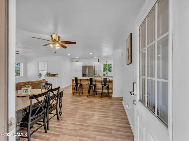 7776 Moonbeam Dr, Flagstaff, AZ 86004 - dining room with ceiling fan, light wood-type flooring, washer / dryer, and recessed lighting