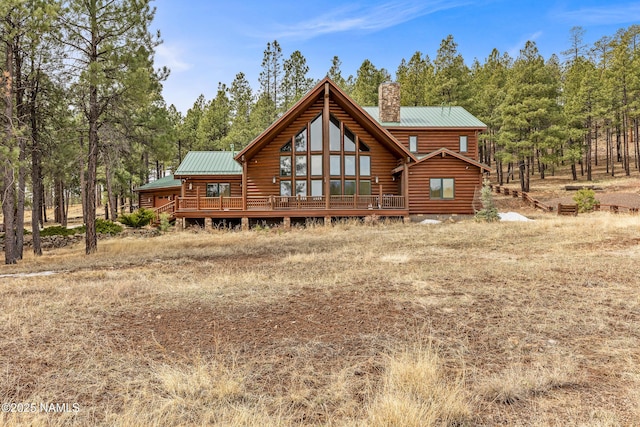 4536 Brackin Ranch Rd, Flagstaff, AZ 86001 - rear view of property with a chimney, metal roof, and log exterior