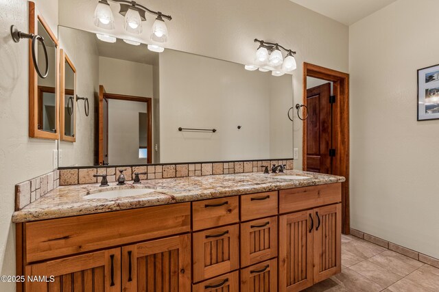 4536 Brackin Ranch Rd, Flagstaff, AZ 86001 - bathroom featuring double vanity, tile patterned flooring, and baseboards