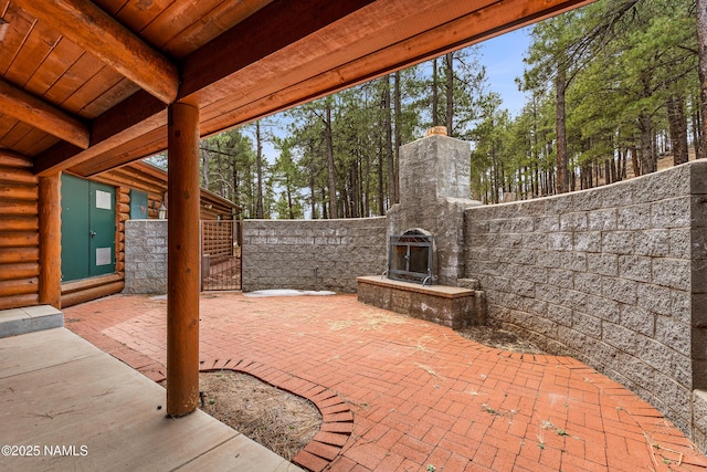 4536 Brackin Ranch Rd, Flagstaff, AZ 86001 - view of patio / terrace featuring an outdoor stone fireplace