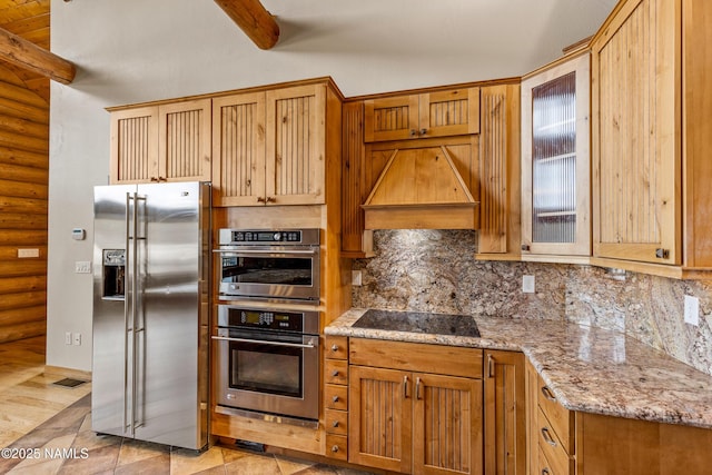 4536 Brackin Ranch Rd, Flagstaff, AZ 86001 - kitchen with stainless steel appliances, rustic walls, custom range hood, tasteful backsplash, and light stone counters