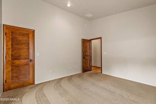 4536 Brackin Ranch Rd, Flagstaff, AZ 86001 - unfurnished room with carpet floors, a towering ceiling, baseboards, and recessed lighting