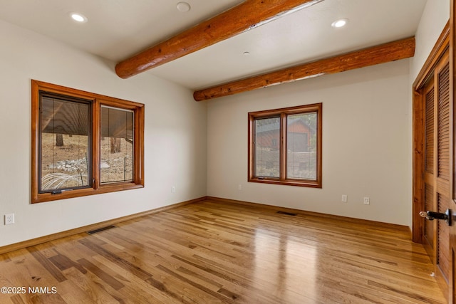 4536 Brackin Ranch Rd, Flagstaff, AZ 86001 - unfurnished room featuring beam ceiling, light wood finished floors, recessed lighting, and baseboards