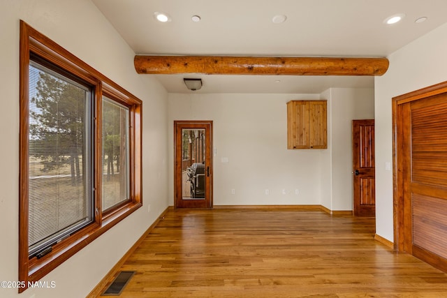 4536 Brackin Ranch Rd, Flagstaff, AZ 86001 - unfurnished room featuring plenty of natural light, light wood-style floors, recessed lighting, baseboards, and beam ceiling