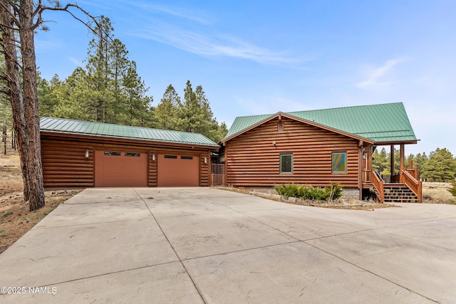 4536 Brackin Ranch Rd, Flagstaff, AZ 86001 - view of home's exterior featuring metal roof and driveway