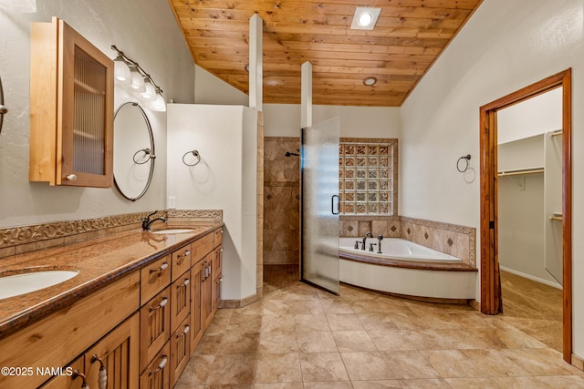 4536 Brackin Ranch Rd, Flagstaff, AZ 86001 - bathroom featuring double vanity, a tile shower, a bath, wooden ceiling, and vaulted ceiling