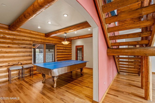 4536 Brackin Ranch Rd, Flagstaff, AZ 86001 - game room with light wood-type flooring, beam ceiling, recessed lighting, rustic walls, and baseboards