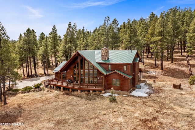 4536 Brackin Ranch Rd, Flagstaff, AZ 86001 - view of front of property with a chimney, metal roof, and log veneer siding