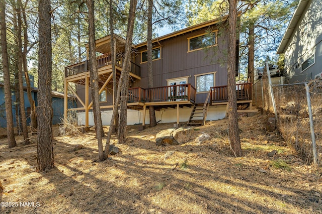 rear view of house with a wooden deck