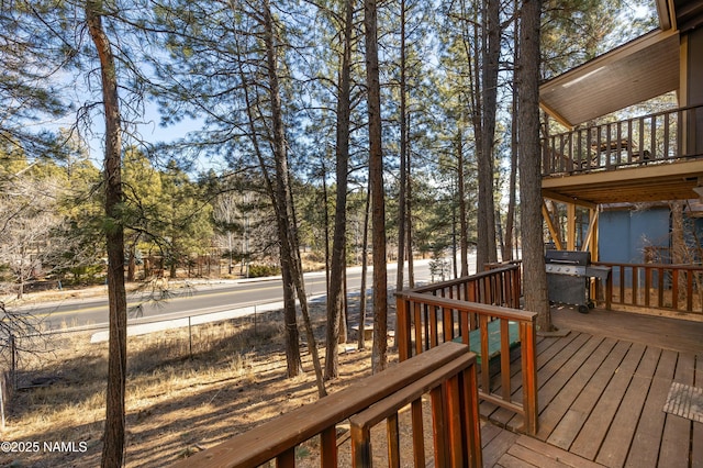 wooden terrace featuring grilling area