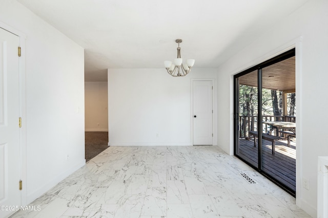 unfurnished room featuring an inviting chandelier