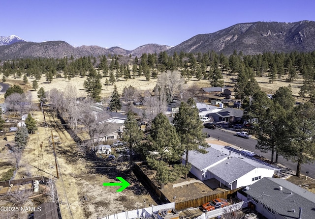 birds eye view of property with a residential view and a mountain view