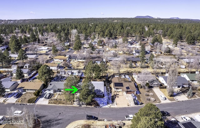 birds eye view of property with a residential view and a mountain view