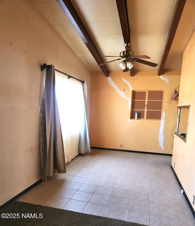 tiled spare room featuring lofted ceiling with beams and ceiling fan